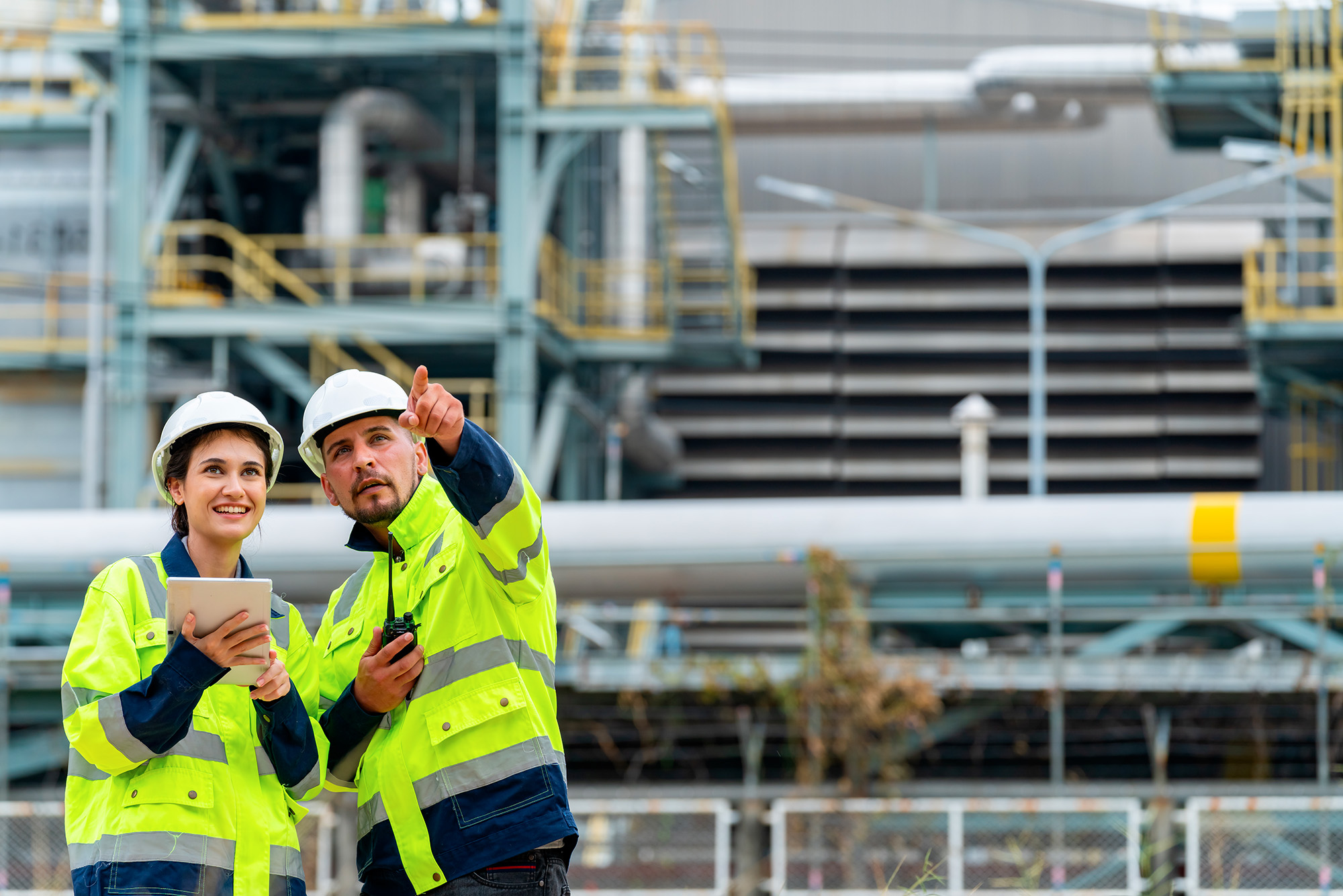 Engineers in front of a factory